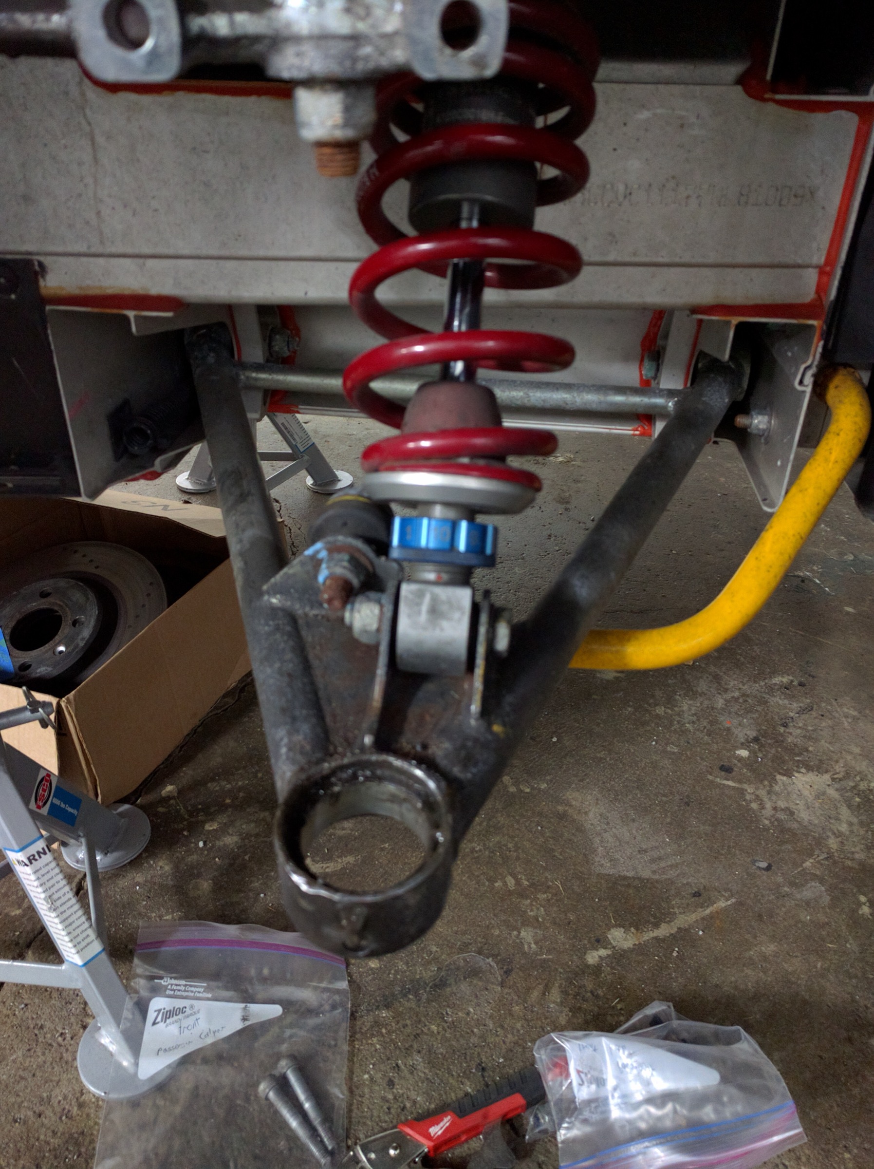 Lotus Exige front wishbone, coilover spring and adjustable sway bar during a rebuild