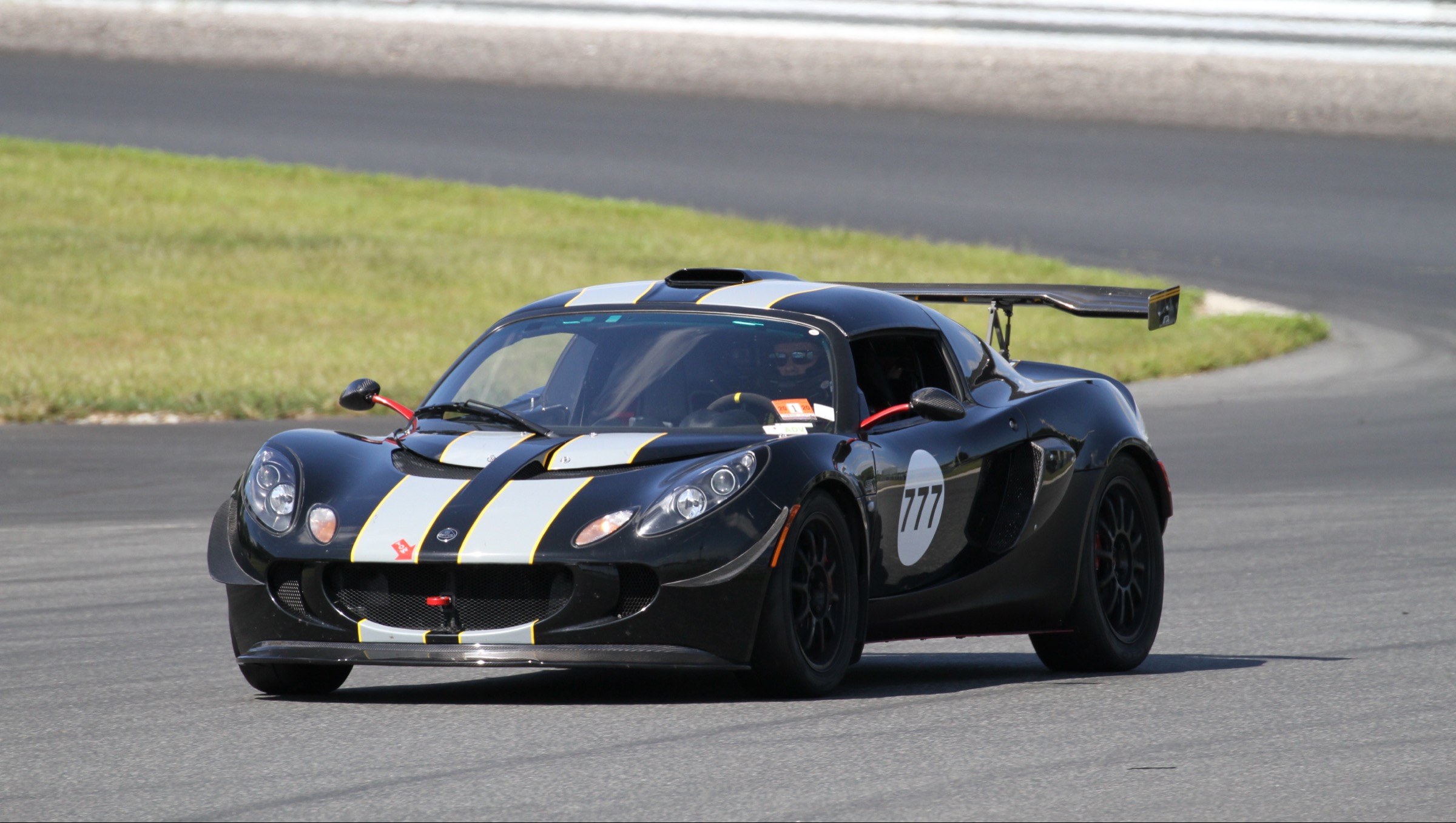 Black Lotus Exige number 777 hard on track at speed